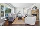 Inviting living room features hardwood floors, natural light, and cozy seating arrangement at 5170 Mt Pleasant N St, Greenwood, IN 46142