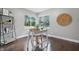 Bright office with a hardwood floor features a large window, a work table, and a decorative ladder shelf at 5170 Mt Pleasant N St, Greenwood, IN 46142