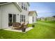 Enjoy the expansive backyard with a patio and outdoor seating, perfect for entertaining guests at 5294 Lndg Pl Ln, Noblesville, IN 46062