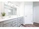 Bright bathroom features a double vanity, white countertops, and wood-look floors at 5294 Lndg Pl Ln, Noblesville, IN 46062
