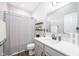 Neutral bathroom with a shower-tub combination and a modern vanity with black hardware at 5294 Lndg Pl Ln, Noblesville, IN 46062