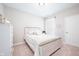 Bright bedroom featuring neutral carpet and an accent wall hanging above the bed at 5294 Lndg Pl Ln, Noblesville, IN 46062