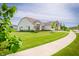 Charming home with a well-manicured lawn and a sidewalk leading to the entrance at 5294 Lndg Pl Ln, Noblesville, IN 46062
