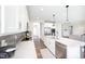 Open-concept kitchen featuring a large island, stainless steel appliances, and ample counter space at 5294 Lndg Pl Ln, Noblesville, IN 46062