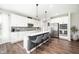 Bright kitchen with a large island, bar stools, stainless appliances, and a neutral color palette at 5294 Lndg Pl Ln, Noblesville, IN 46062