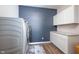 Laundry room showcases modern appliances, sleek cabinets, and a functional workspace at 5294 Lndg Pl Ln, Noblesville, IN 46062