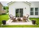 Relax on the patio with a table and chairs on a sunny day near sliding glass doors at 5294 Lndg Pl Ln, Noblesville, IN 46062