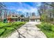 Spacious property features a two-story home, detached garage, playset, and long driveway at 5386 W 1100, Fountaintown, IN 46130