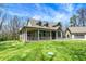 Beautiful two-story home with a covered porch and lush green lawn, on a sunny day at 5386 W 1100, Fountaintown, IN 46130