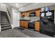 This kitchen features wooden cabinets, dark countertops, stainless steel appliances, and a black refrigerator at 5386 W 1100, Fountaintown, IN 46130