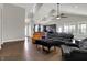 Open floor plan shows the kitchen, dining area, and living room with vaulted ceilings and lots of light at 5386 W 1100, Fountaintown, IN 46130