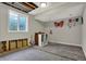 Unfinished basement space with visible utilities, and a large window allowing for ample sunlight at 5386 W 1100, Fountaintown, IN 46130