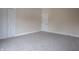 Bedroom boasts neutral walls with carpeted floors and multiple storage options at 5511 E University Ave, Indianapolis, IN 46219