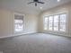 Spacious bedroom with large windows offering bright natural light and neutral color scheme at 5511 E University Ave, Indianapolis, IN 46219