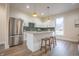 Modern kitchen features stainless steel appliances, a central island, and sleek white cabinetry at 5511 E University Ave, Indianapolis, IN 46219