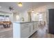 Modern kitchen featuring stainless appliances, a center island, and seamless flow to the dining area at 5511 E University Ave, Indianapolis, IN 46219