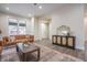 View of an open-concept living room featuring a sofa, cabinet, and seamless transition to other areas at 5511 E University Ave, Indianapolis, IN 46219