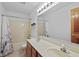 Bathroom featuring double sinks, neutral countertop, and a shower/tub combo at 5591 Royal Troon Way, Avon, IN 46123