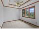Bright bedroom with trim details, a ceiling fan, and large windows overlooking the backyard at 5591 Royal Troon Way, Avon, IN 46123