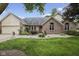 Charming single story brick home features a well manicured lawn and established landscaping at 5591 Royal Troon Way, Avon, IN 46123