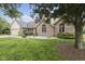 Well maintained brick home with a manicured lawn and beautiful landscaping at 5591 Royal Troon Way, Avon, IN 46123
