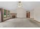 Spacious living room featuring neutral carpet, fireplace, and lots of natural light at 5591 Royal Troon Way, Avon, IN 46123