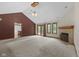 Large living room with vaulted ceilings, a fireplace, and access to the back patio at 5591 Royal Troon Way, Avon, IN 46123