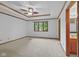 Spacious main bedroom with trim details, ceiling fan, large window, and an ensuite bathroom at 5591 Royal Troon Way, Avon, IN 46123