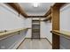 Organized walk-in closet with shelving and clothing rods at 5591 Royal Troon Way, Avon, IN 46123