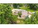 Aerial view of a well maintained home with mature trees in a park like setting and a large backyard at 5982 Oak Hill East Dr, Plainfield, IN 46168