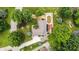 An aerial view shows the home with a large backyard, a deck, a shed, and mature trees surrounding the lot at 5982 Oak Hill East Dr, Plainfield, IN 46168