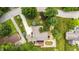 Aerial view of the home on a neatly manicured lot with lush trees in a quiet residential neighborhood at 5982 Oak Hill East Dr, Plainfield, IN 46168