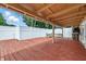 Enclosed back porch with a painted wooden floor and built in stone features great for relaxing and entertaining at 5982 Oak Hill East Dr, Plainfield, IN 46168