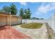 Private backyard with a white fence, small manicured lawn, and concrete patio perfect for outdoor entertaining at 5982 Oak Hill East Dr, Plainfield, IN 46168