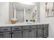 Bathroom features a white countertop sink, gray cabinets, and ample storage space at 5982 Oak Hill East Dr, Plainfield, IN 46168