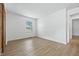 Light-filled bedroom featuring modern flooring, a closet and a bright window at 5982 Oak Hill East Dr, Plainfield, IN 46168