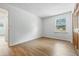 A spacious, light-filled bedroom features modern flooring and a view to the outside at 5982 Oak Hill East Dr, Plainfield, IN 46168