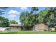 Charming single story home with a stone and wood exterior, lush landscaping, and a well maintained front lawn at 5982 Oak Hill East Dr, Plainfield, IN 46168