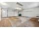 Spacious two car garage features a white door, storage shelves, and plenty of room for parking and projects at 5982 Oak Hill East Dr, Plainfield, IN 46168