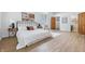 Spacious main bedroom with vaulted ceiling, ample natural light, and hardwood floors at 5982 Oak Hill East Dr, Plainfield, IN 46168