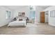 Airy main bedroom featuring vaulted ceiling, natural light, and hardwood floors at 5982 Oak Hill East Dr, Plainfield, IN 46168