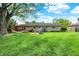 A spacious backyard with lush green grass and a charming hammock at 621 S Jefferson St, Brownsburg, IN 46112