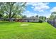 This backyard features lush green grass, a firepit and a hammock at 621 S Jefferson St, Brownsburg, IN 46112