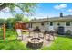 The backyard features an outdoor fire pit and well-maintained lawn at 621 S Jefferson St, Brownsburg, IN 46112