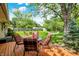Backyard showcasing outdoor seating, lush lawn, and shade trees at 621 S Jefferson St, Brownsburg, IN 46112