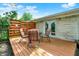 A backyard featuring a cozy wooden deck with comfortable patio furniture at 621 S Jefferson St, Brownsburg, IN 46112