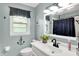 Bathroom featuring an anchor theme with a white sink and a window at 621 S Jefferson St, Brownsburg, IN 46112