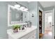 Well lit bathroom featuring white vanity, neutral paint, and built-in closet at 621 S Jefferson St, Brownsburg, IN 46112