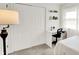 Bedroom featuring white closet doors, a desk, and neutral-colored carpet at 621 S Jefferson St, Brownsburg, IN 46112