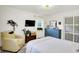 Bedroom features a large dresser, and closet doors with decorative film at 621 S Jefferson St, Brownsburg, IN 46112